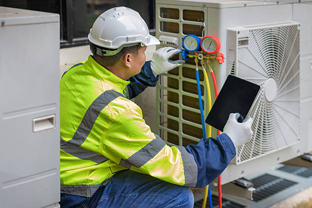 Professional Heat Pump Repair technician working in Haw River, NC